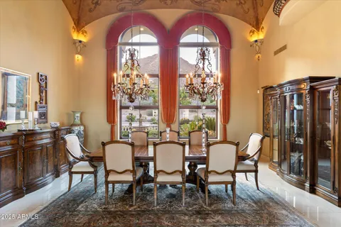 a bathroom with a granite countertop sink a mirror and shower