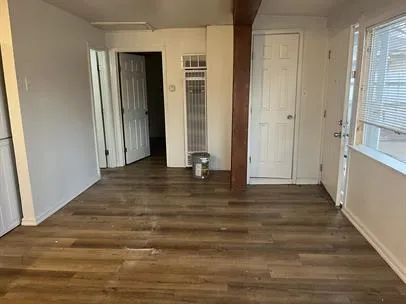 a view of room with window and hardwood