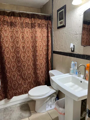 a bathroom with a sink and a toilet