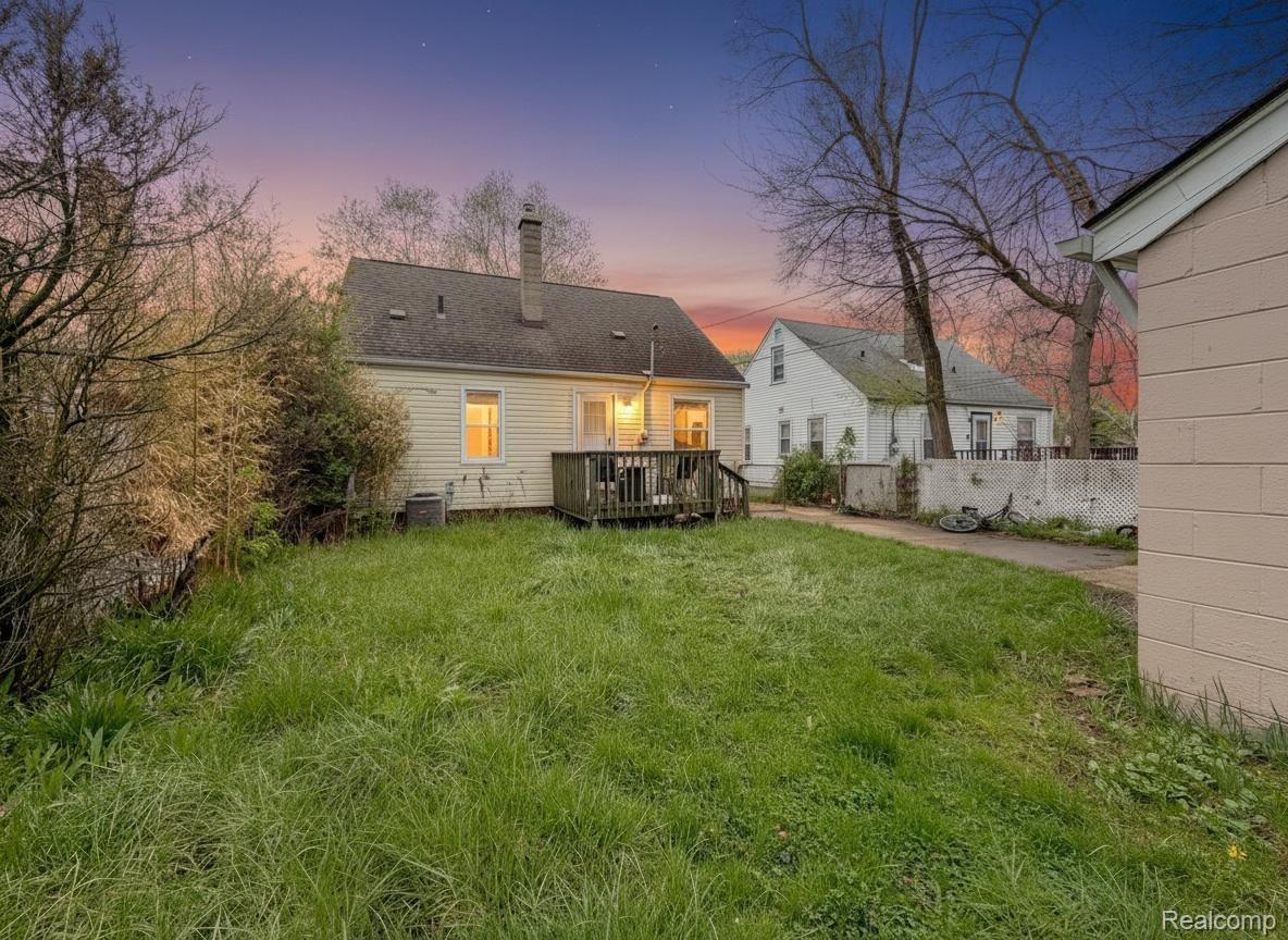 24811 Valley Avenue Eastpointe, MI 48021 - Photo 19 of 22 Back of house at dusk with a deck and a chimney