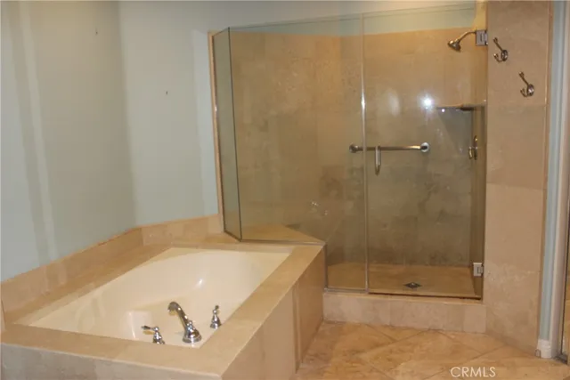 a view of a patio with table and chairs potted plants