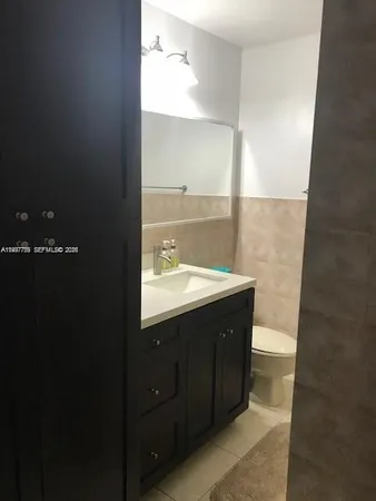 a bathroom with a sink and mirror