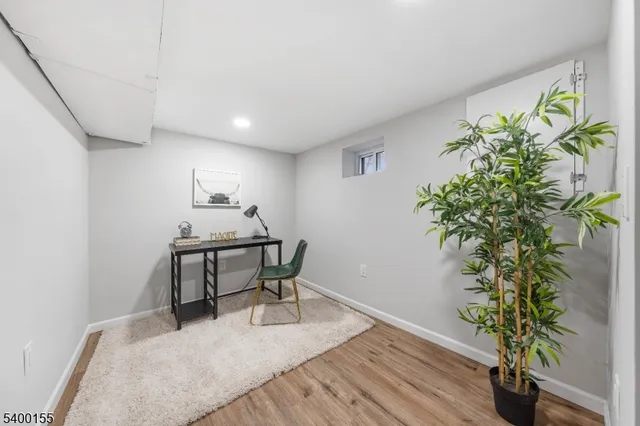 a workspace with furniture and a potted plant