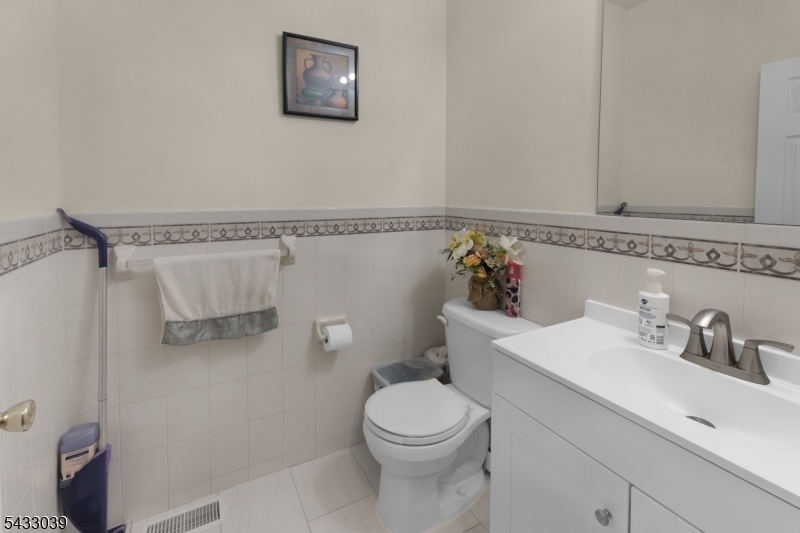 158 Autumn Ridge Road Morris Plains, NJ 07950 - Photo 17 of 26 a bathroom with a sink mirror vanity and toilet