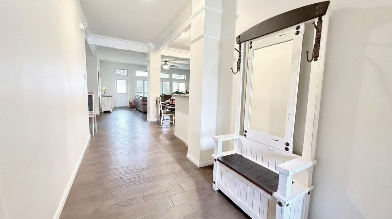 2504 Rosa Rita Drive League City, TX 77573 - Photo 13 of 41 a hallway with a large mirror and furniture