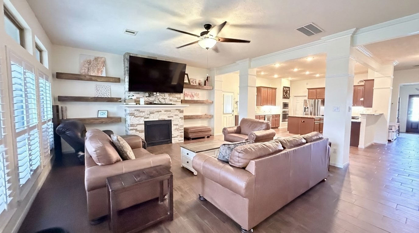2504 Rosa Rita Drive League City, TX 77573 - Photo 18 of 44 a living room with furniture fireplace and a flat screen tv