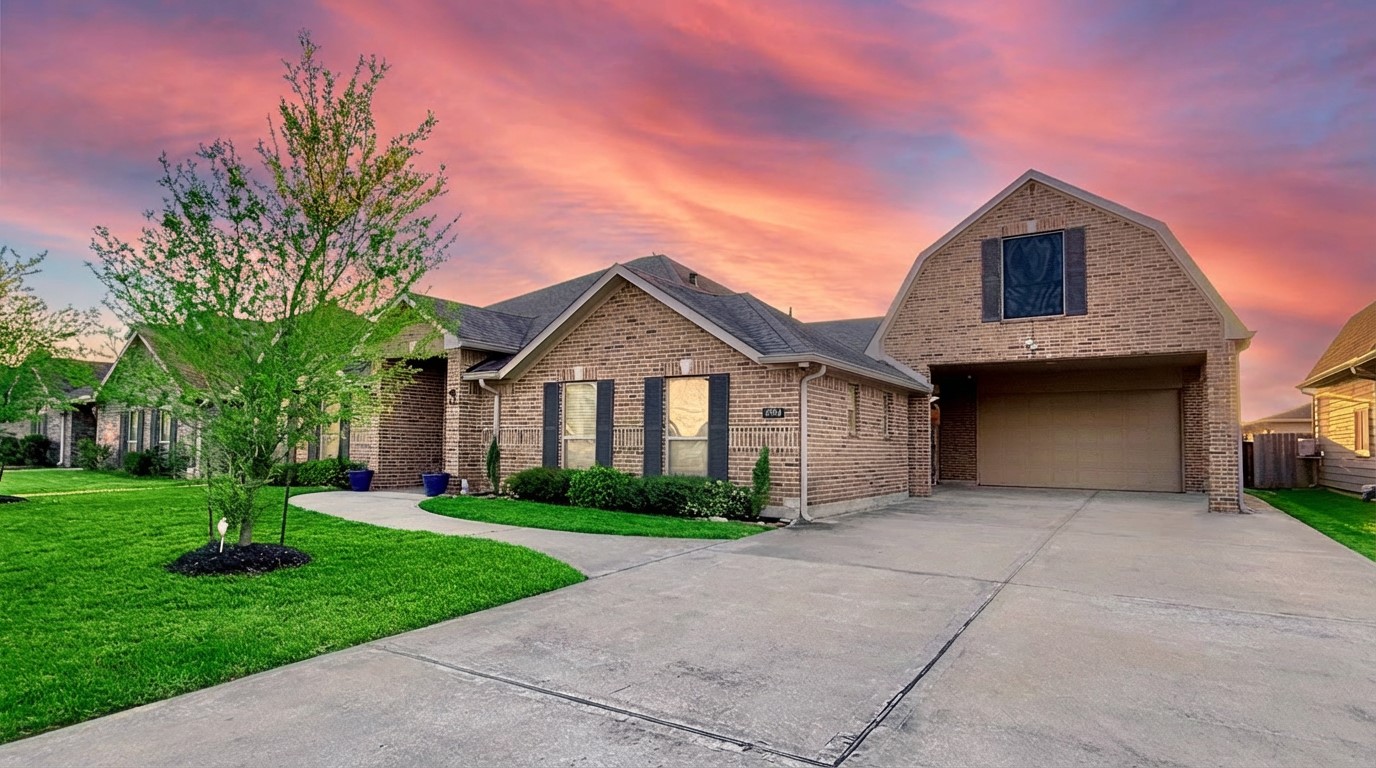 2504 Rosa Rita Drive League City, TX 77573 - Photo 2 of 44 a front view of a house with a yard and garage