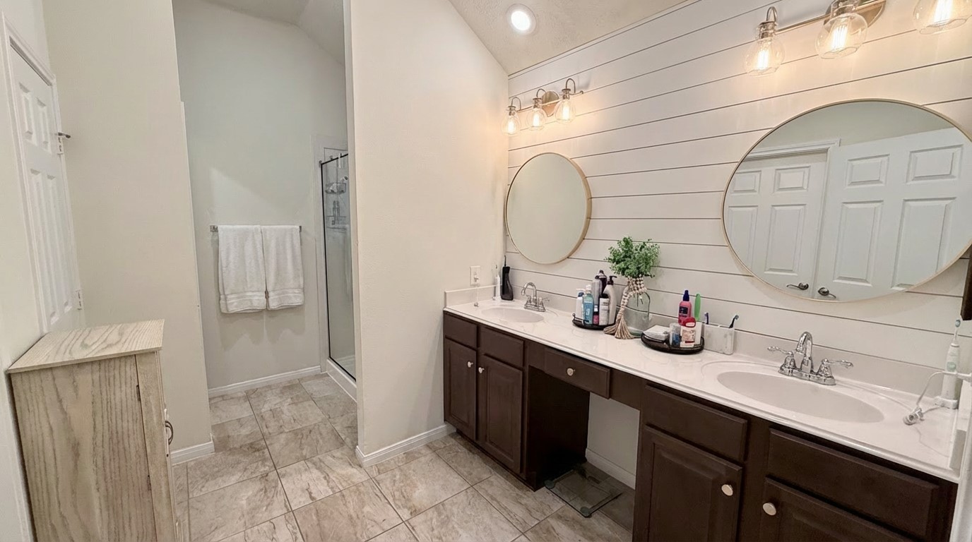 2504 Rosa Rita Drive League City, TX 77573 - Photo 23 of 41 a bathroom with a double vanity sink mirror and