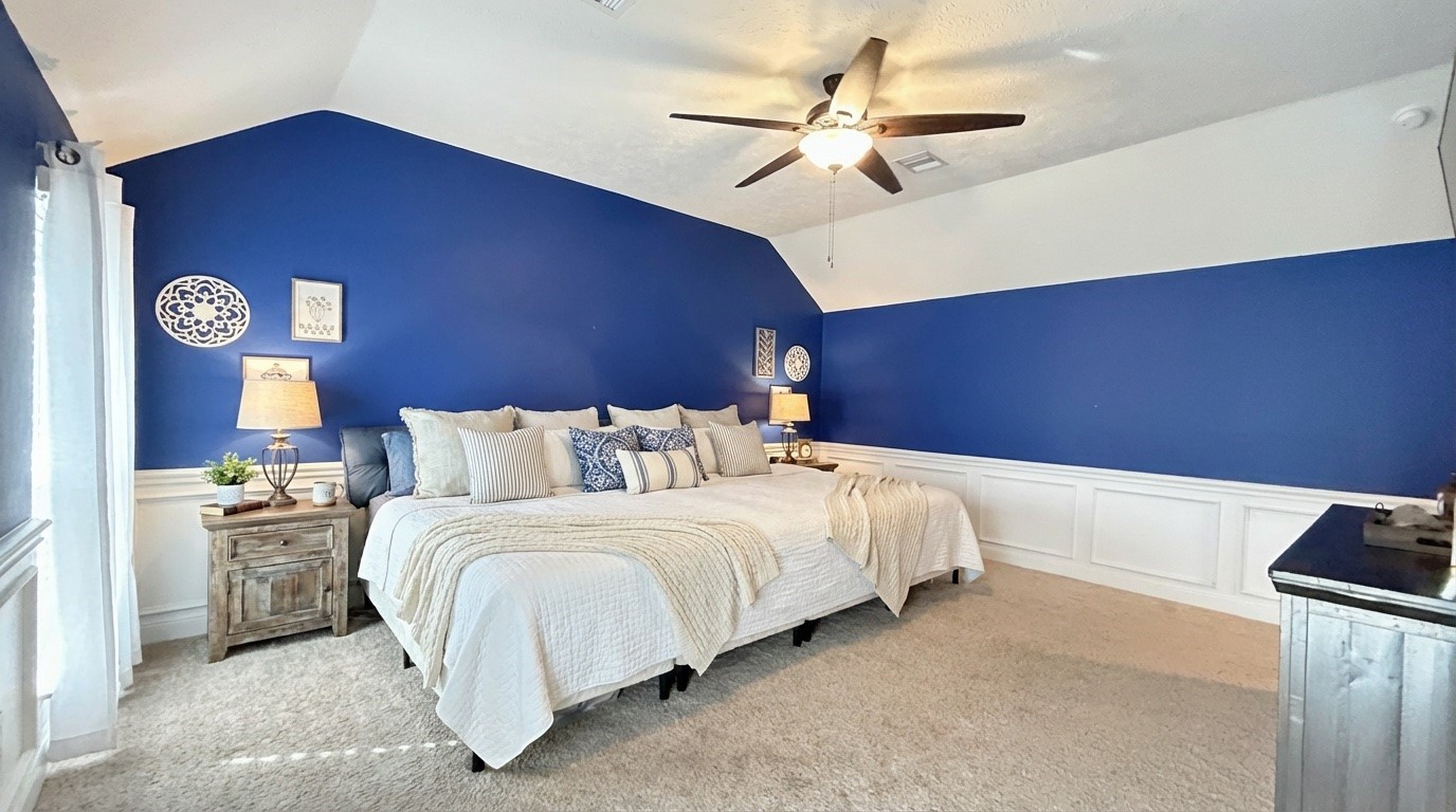 2504 Rosa Rita Drive League City, TX 77573 - Photo 8 of 44 a bedroom with a bed and a ceiling fan