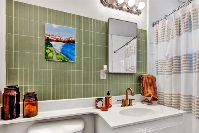 a bathroom with a double vanity sink and a mirror