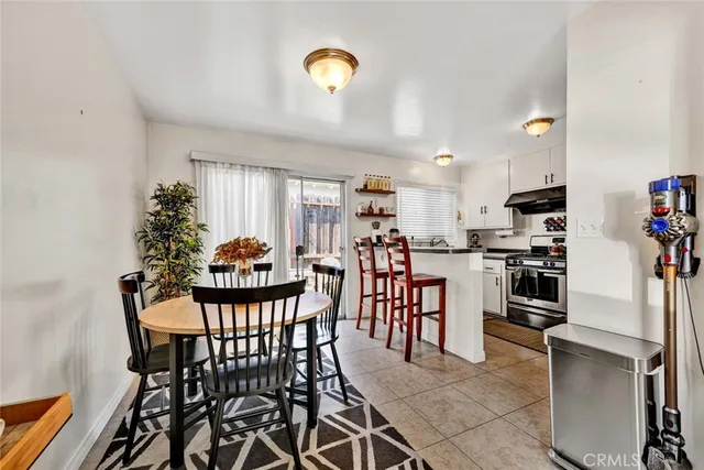 a kitchen with stainless steel appliances a sink a stove and a window
