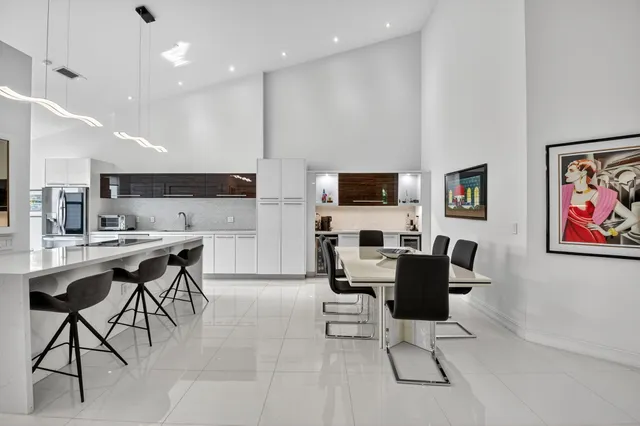 a kitchen with stainless steel appliances granite countertop a sink and cabinets