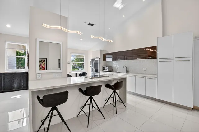 a kitchen with granite countertop cabinets and steel stainless steel appliances
