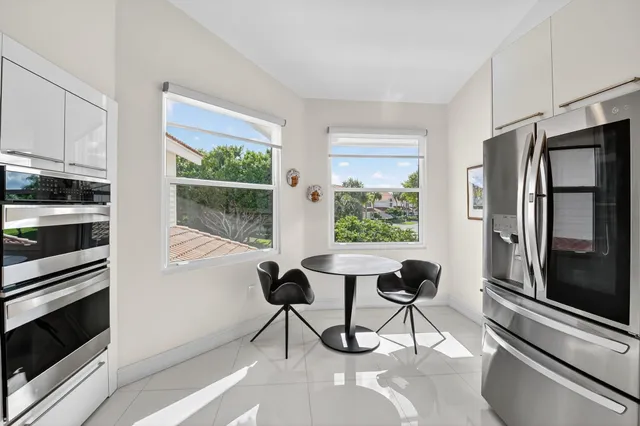 a bedroom with a bed and glass window