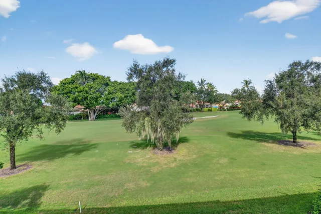 an aerial view of residential house with outdoor space and swimming pool