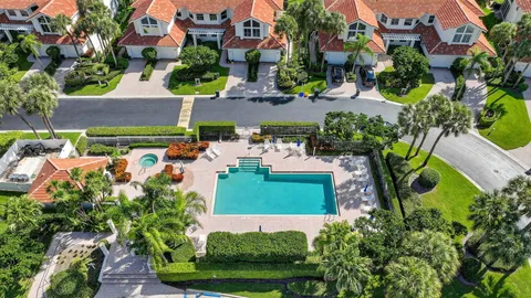 a view of swimming pool with outdoor seating and plants