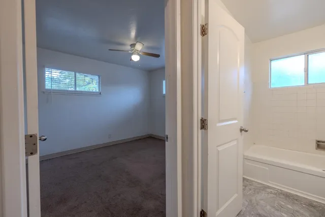 a view of a bathroom with a bathtub