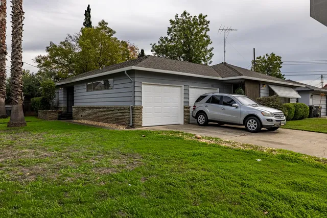 a view of a car parked in front of a house
