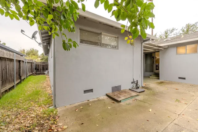a aerial view of a house with garden space and outdoor seating