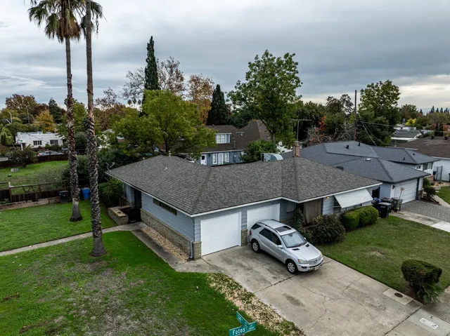 an aerial view of a house with a garden