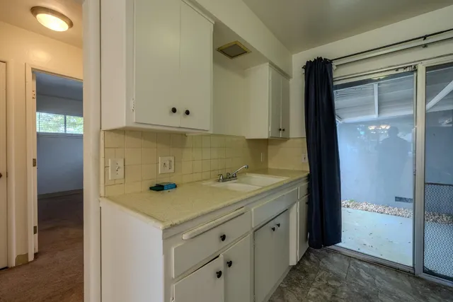 a view of a bathroom with a sink and mirror