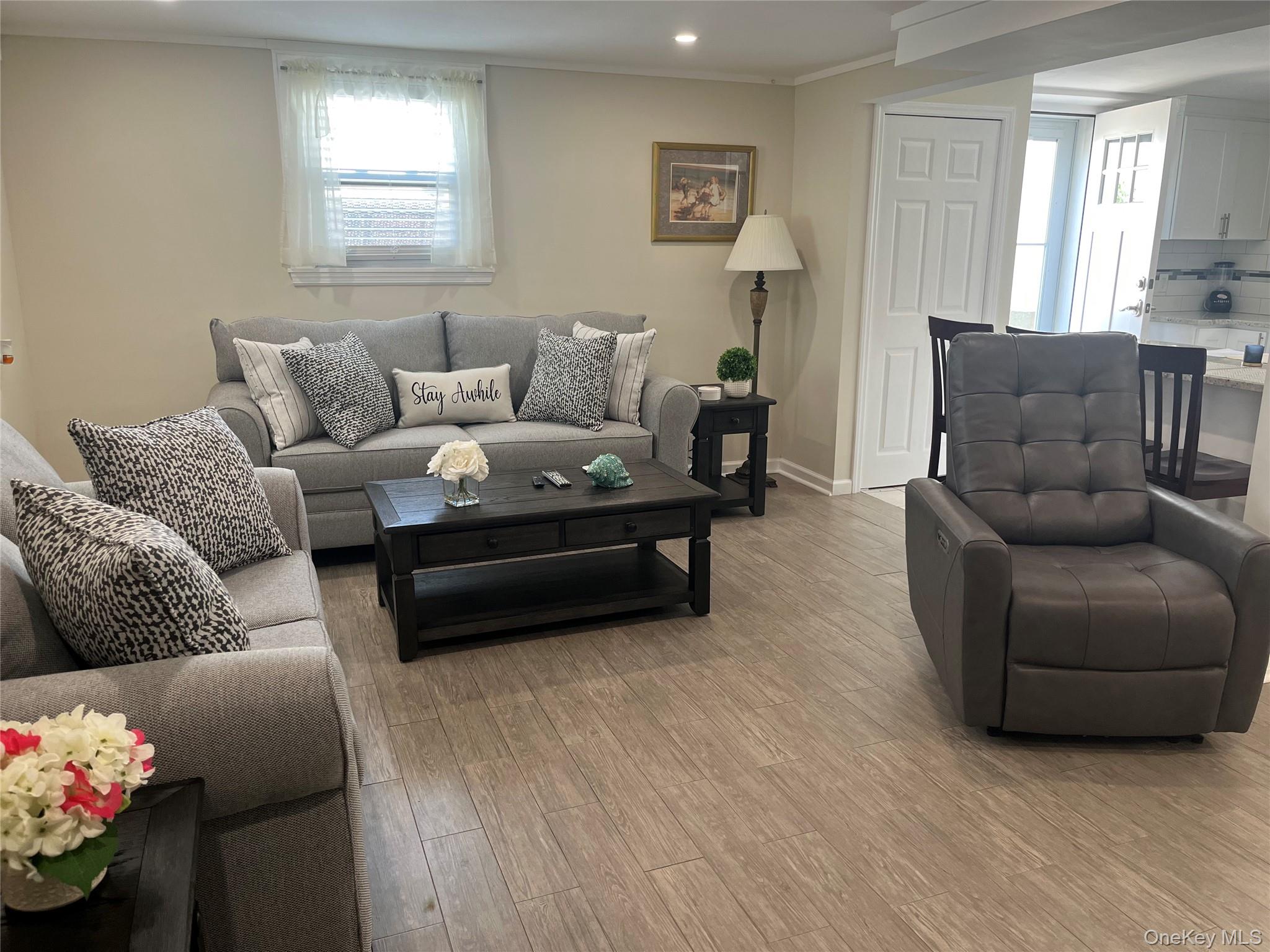 321 West Walnut Street, Unit 2 Long Beach, NY 11561 - Photo 11 of 13 a living room with furniture and a couch