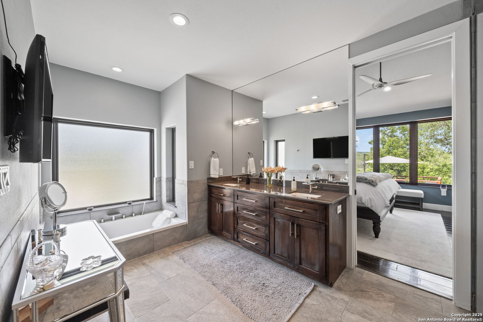 172 Bluff Street Dripping Springs, TX 78620 - Photo 15 of 39 a view of a kitchen with kitchen island granite countertop lots of counter top space and stainless steel appliances