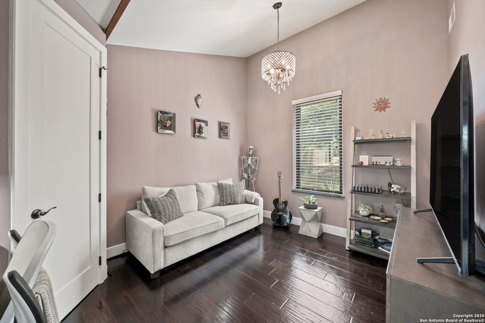 172 Bluff Street Dripping Springs, TX 78620 - Photo 19 of 39 a living room with furniture and a flat screen tv