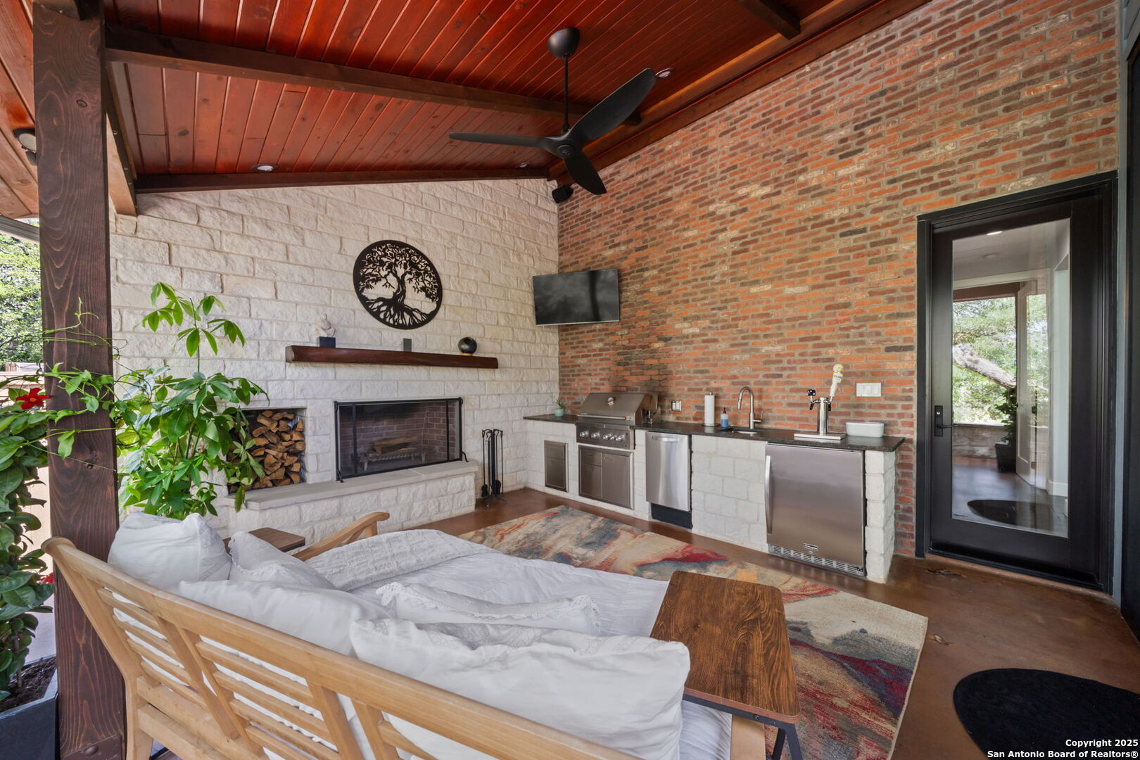 172 Bluff Street Dripping Springs, TX 78620 - Photo 3 of 39 a living room with furniture and a fireplace