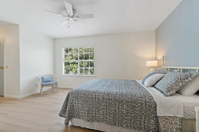 a bedroom with a bed and chair