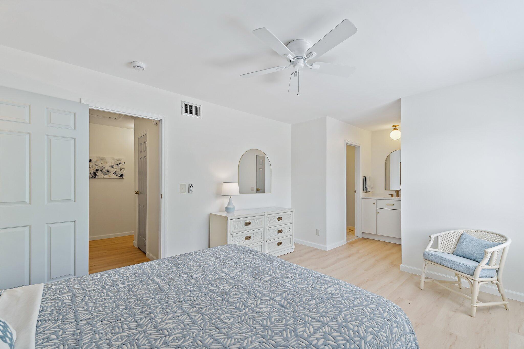 11830 Brier Patch Court Wellington, FL 33414 - Photo 18 of 34 a bedroom with a bed and a chair