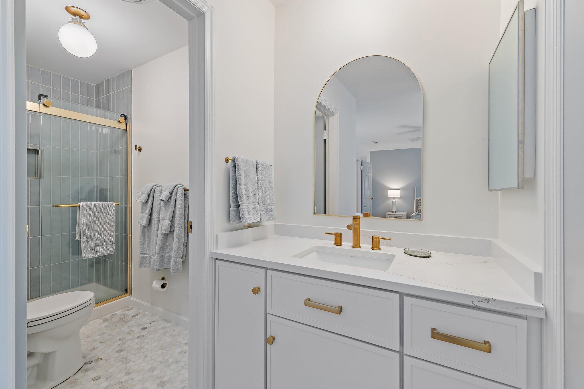 11830 Brier Patch Court Wellington, FL 33414 - Photo 19 of 34 a bathroom with a double vanity sink mirror and shower