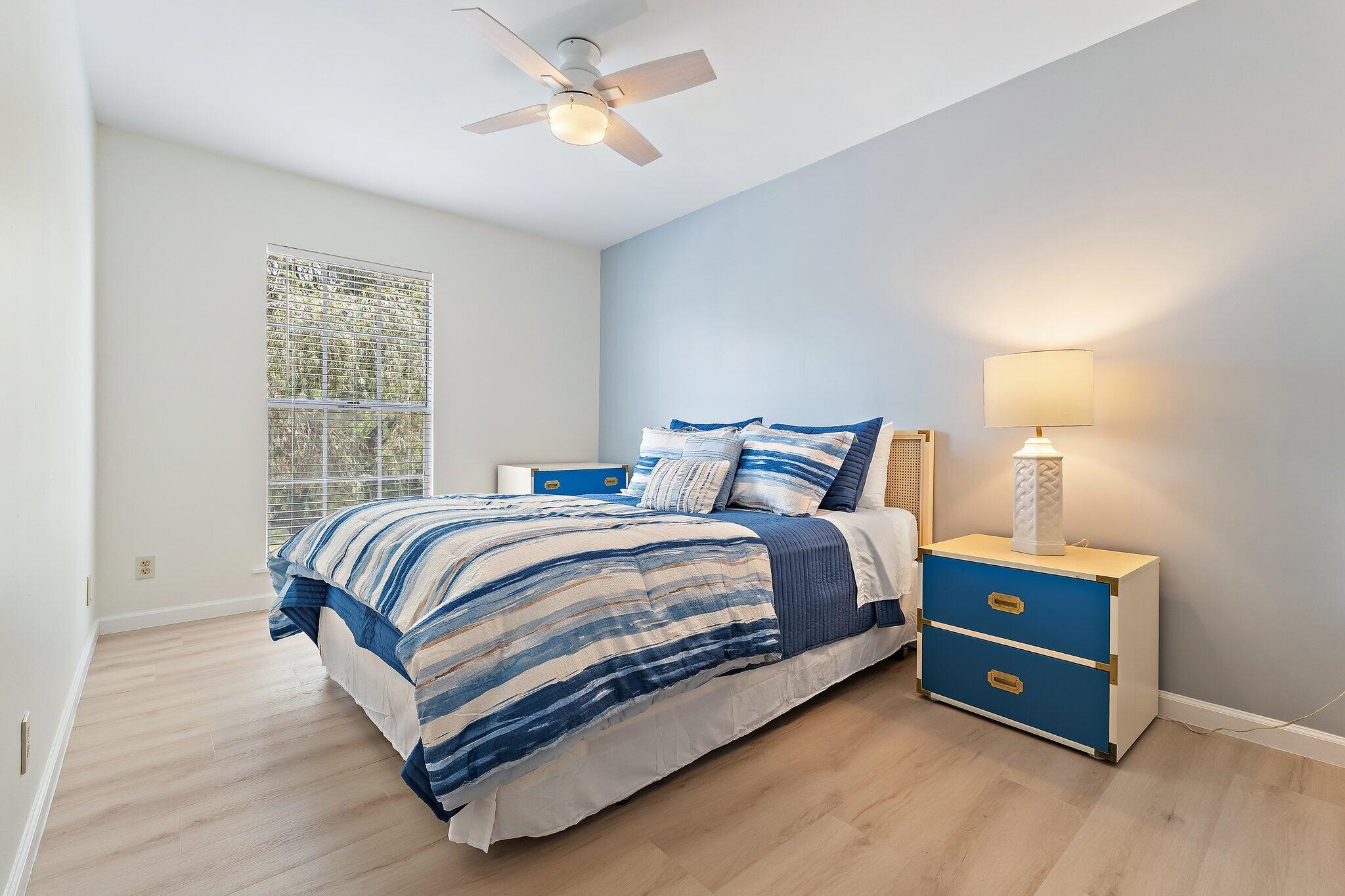 11830 Brier Patch Court Wellington, FL 33414 - Photo 25 of 34 a bedroom with a bed and a window