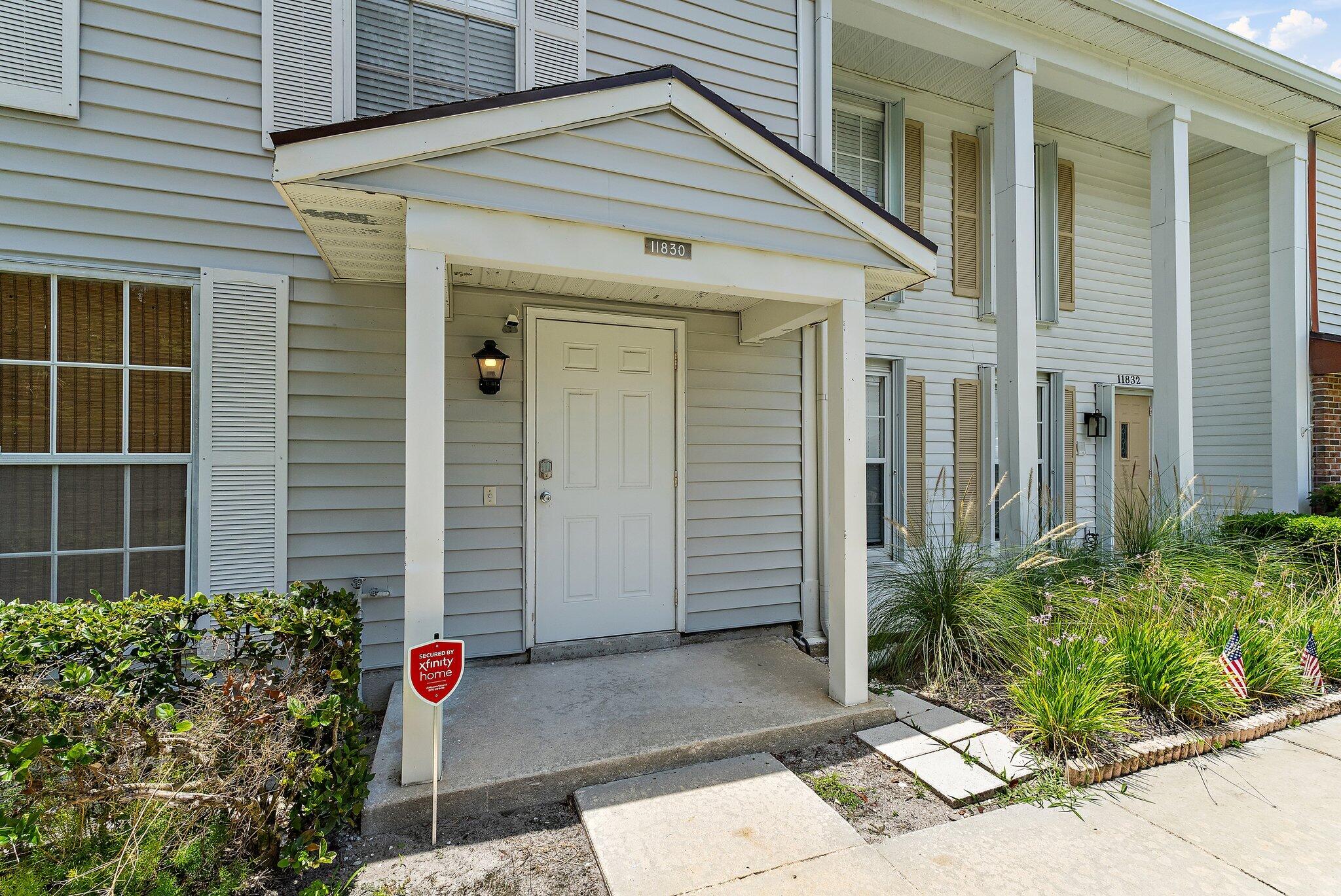 11830 Brier Patch Court Wellington, FL 33414 - Photo 33 of 34 a front view of a house with a yard