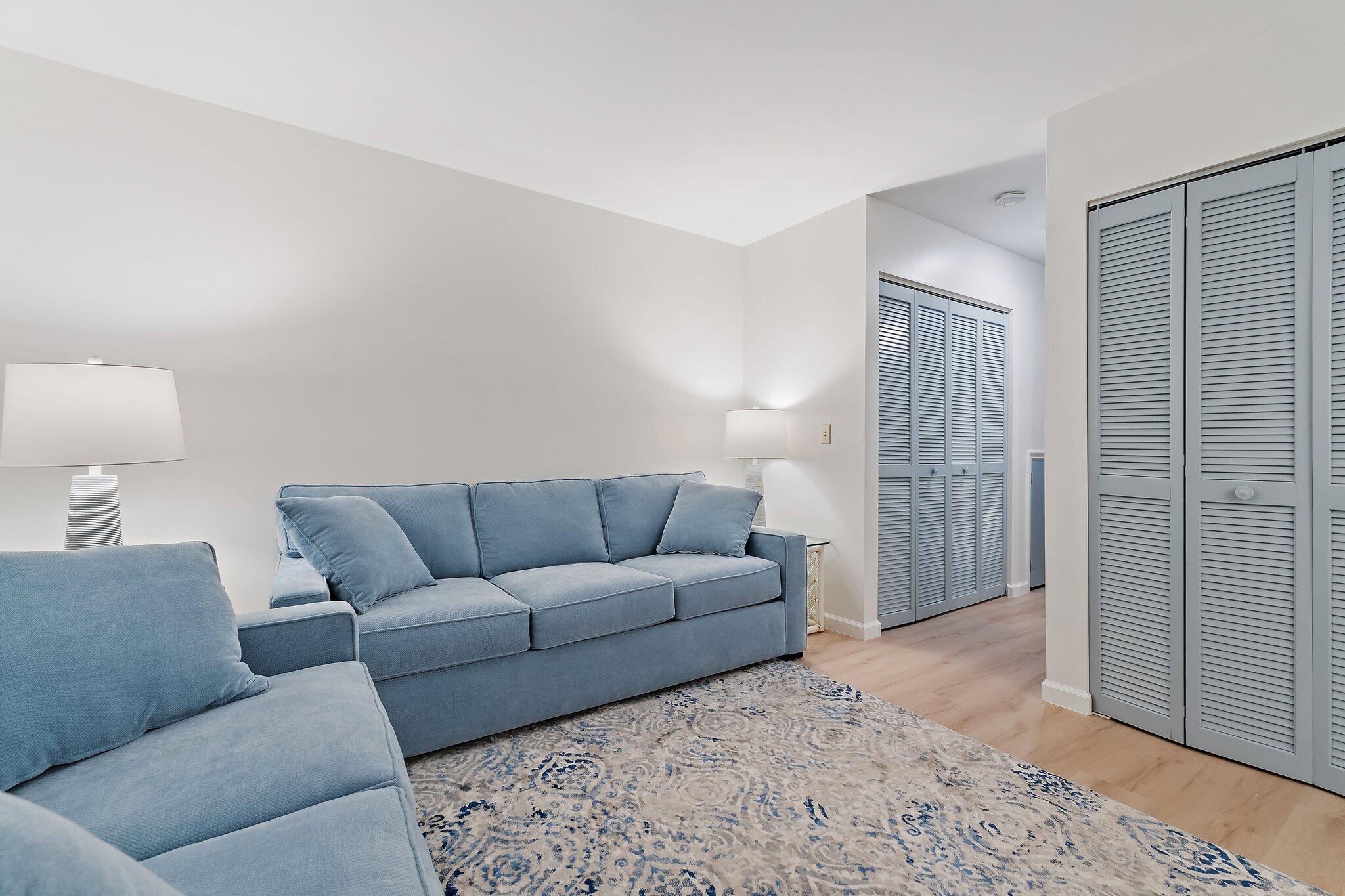 11830 Brier Patch Court Wellington, FL 33414 - Photo 8 of 34 a living room with furniture a lamp and a rug