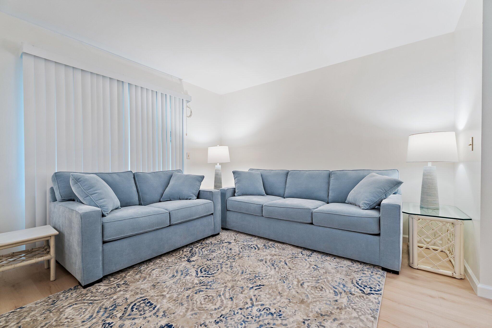11830 Brier Patch Court Wellington, FL 33414 - Photo 9 of 34 a living room with furniture a lamp and a window