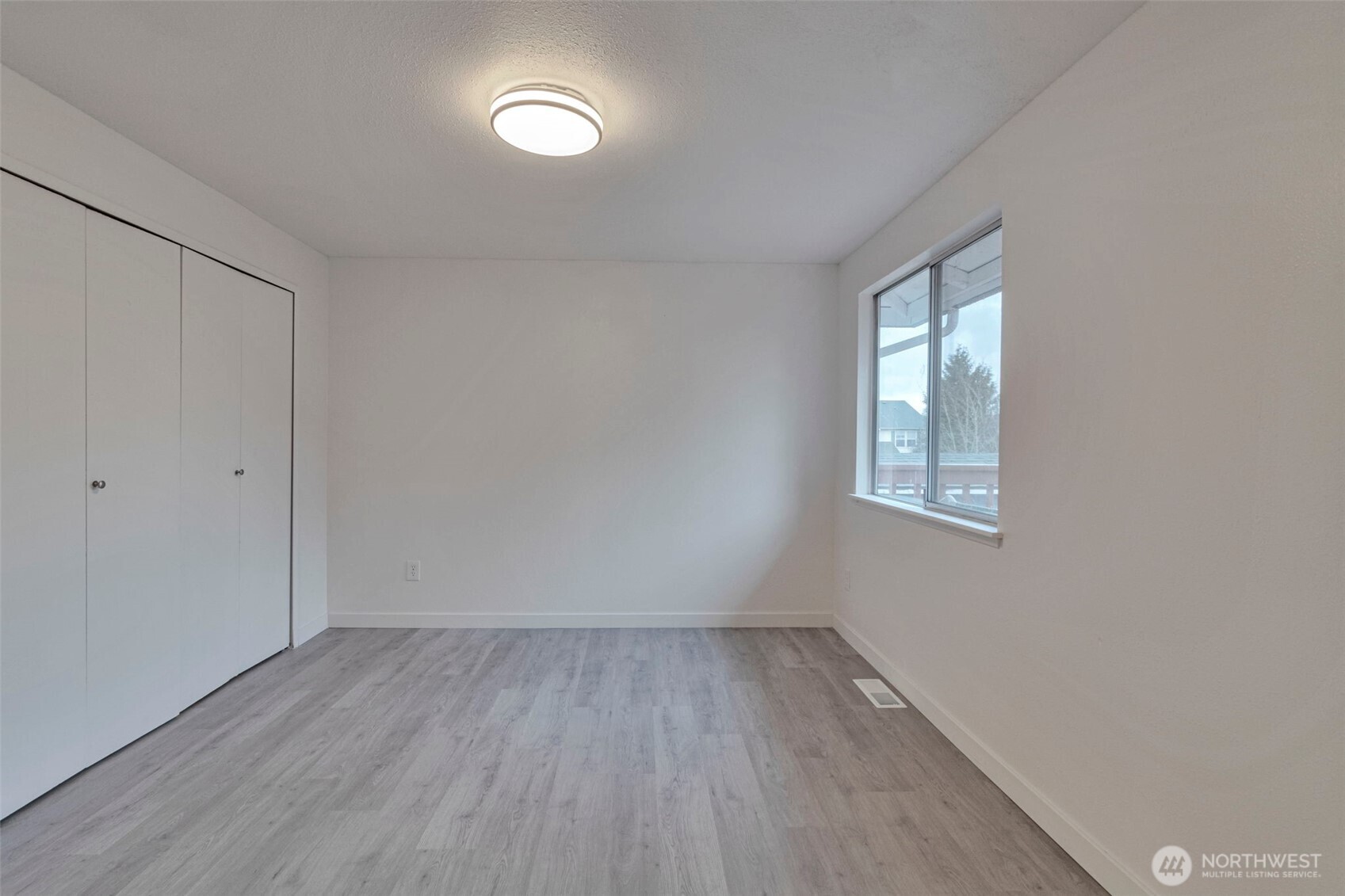 25810 129th Place Southeast Kent, WA 98030 - Photo 11 of 25 wooden floor in an empty room with a window