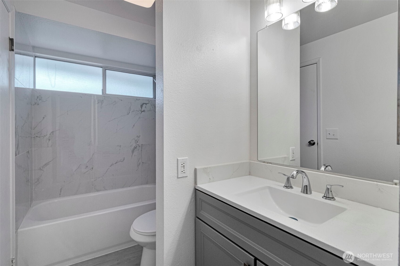 25810 129th Place Southeast Kent, WA 98030 - Photo 12 of 25 a bathroom with a sink toilet and shower