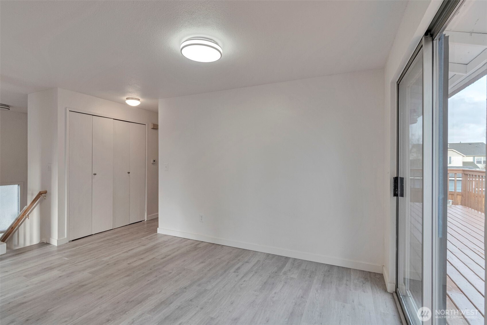 25810 129th Place Southeast Kent, WA 98030 - Photo 14 of 25 a view of an empty room with wooden floor and a window