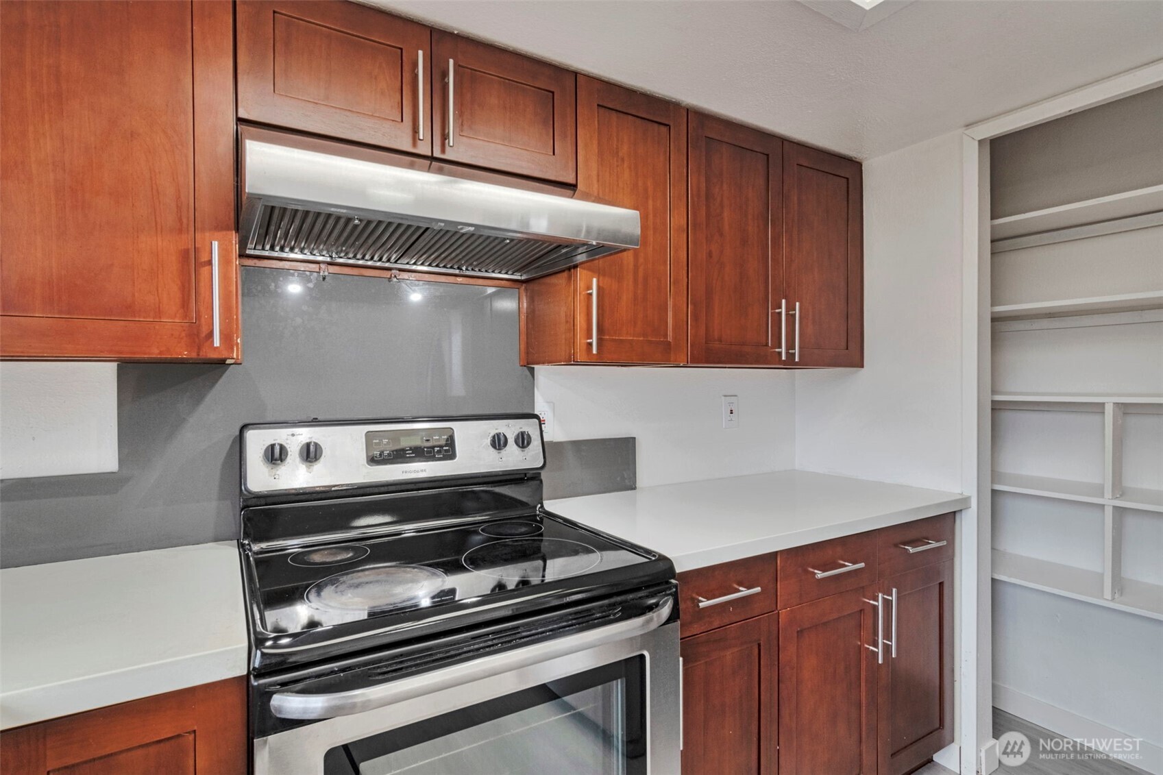 25810 129th Place Southeast Kent, WA 98030 - Photo 15 of 25 a kitchen with a stove and a microwave
