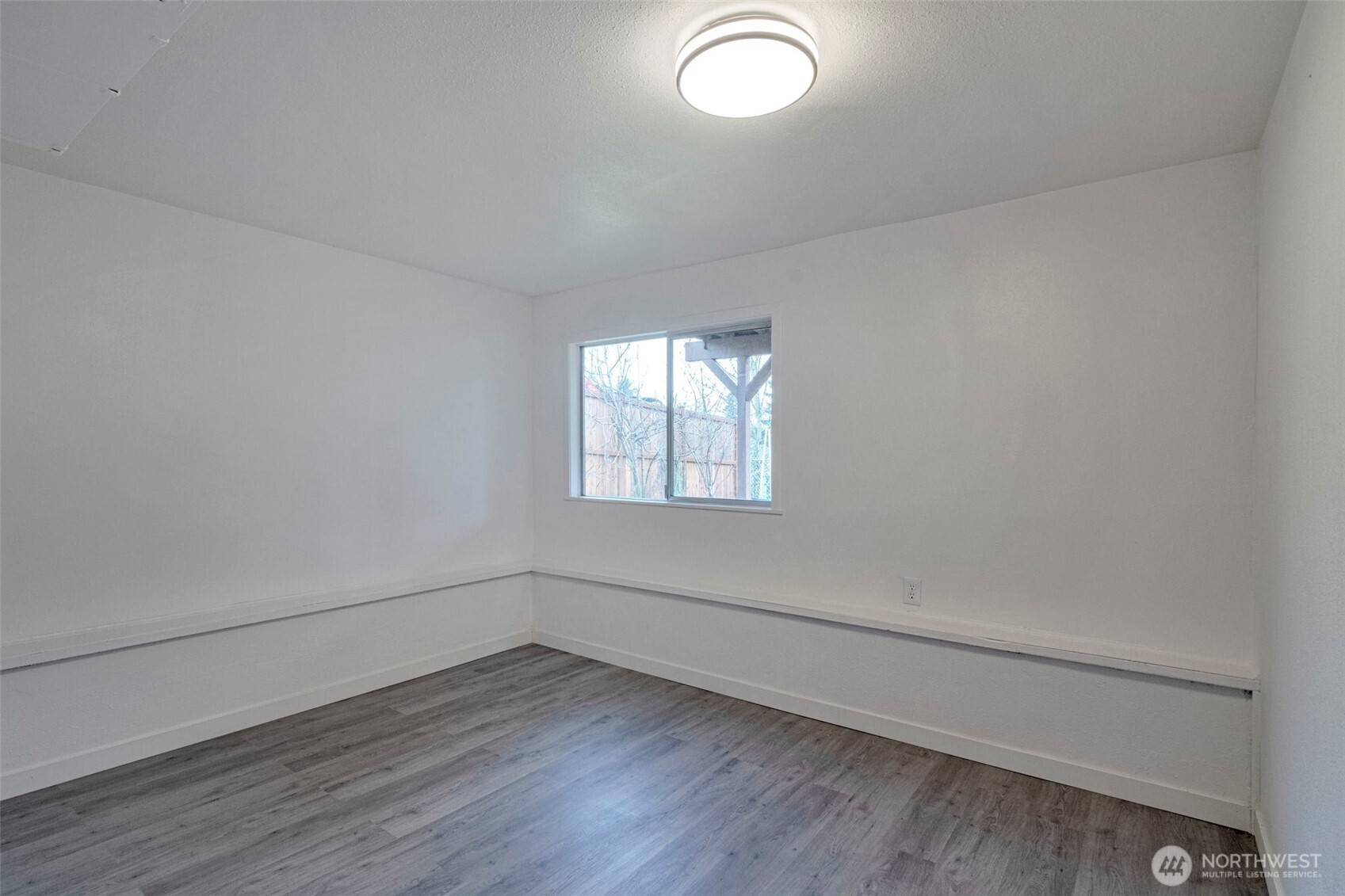 25810 129th Place Southeast Kent, WA 98030 - Photo 17 of 25 wooden floor in an empty room with a window