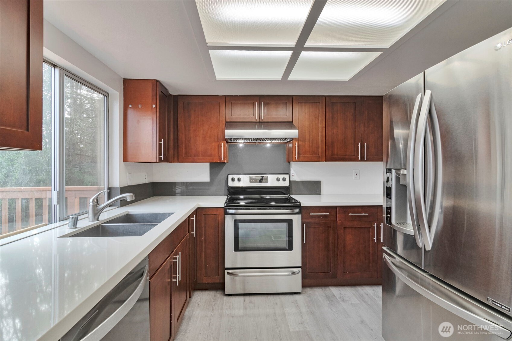 25810 129th Place Southeast Kent, WA 98030 - Photo 2 of 25 a kitchen with stainless steel appliances granite countertop a sink stove and refrigerator