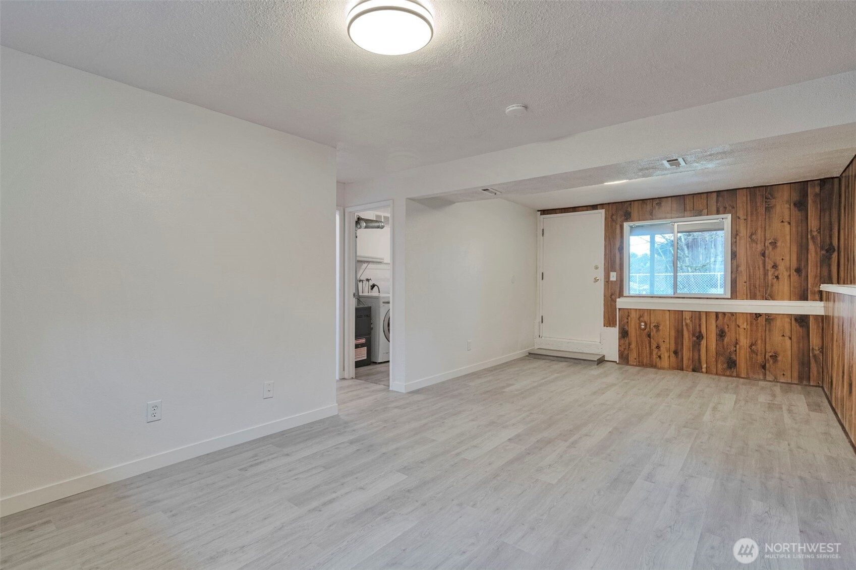 25810 129th Place Southeast Kent, WA 98030 - Photo 22 of 25 an empty room with wooden floor and windows