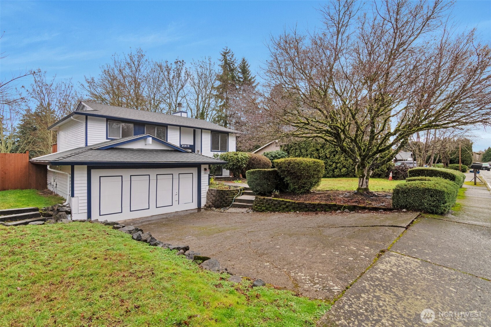 25810 129th Place Southeast Kent, WA 98030 - Photo 5 of 25 a view of a house with a yard and large tree