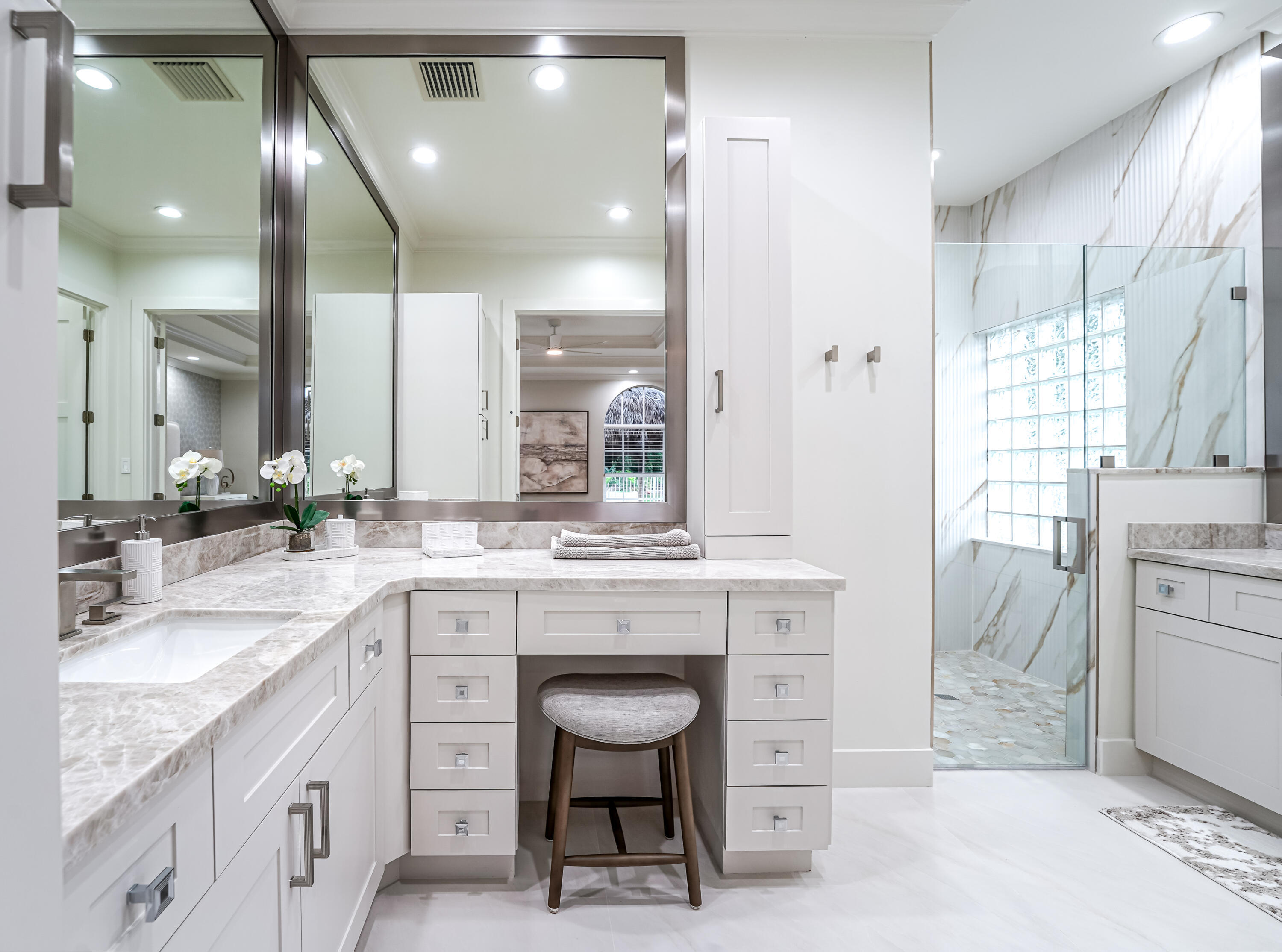 749 Northeast 71st Street Boca Raton, FL 33487 - Photo 18 of 43 a spacious bathroom with a granite countertop sink a toilet a mirror and shower