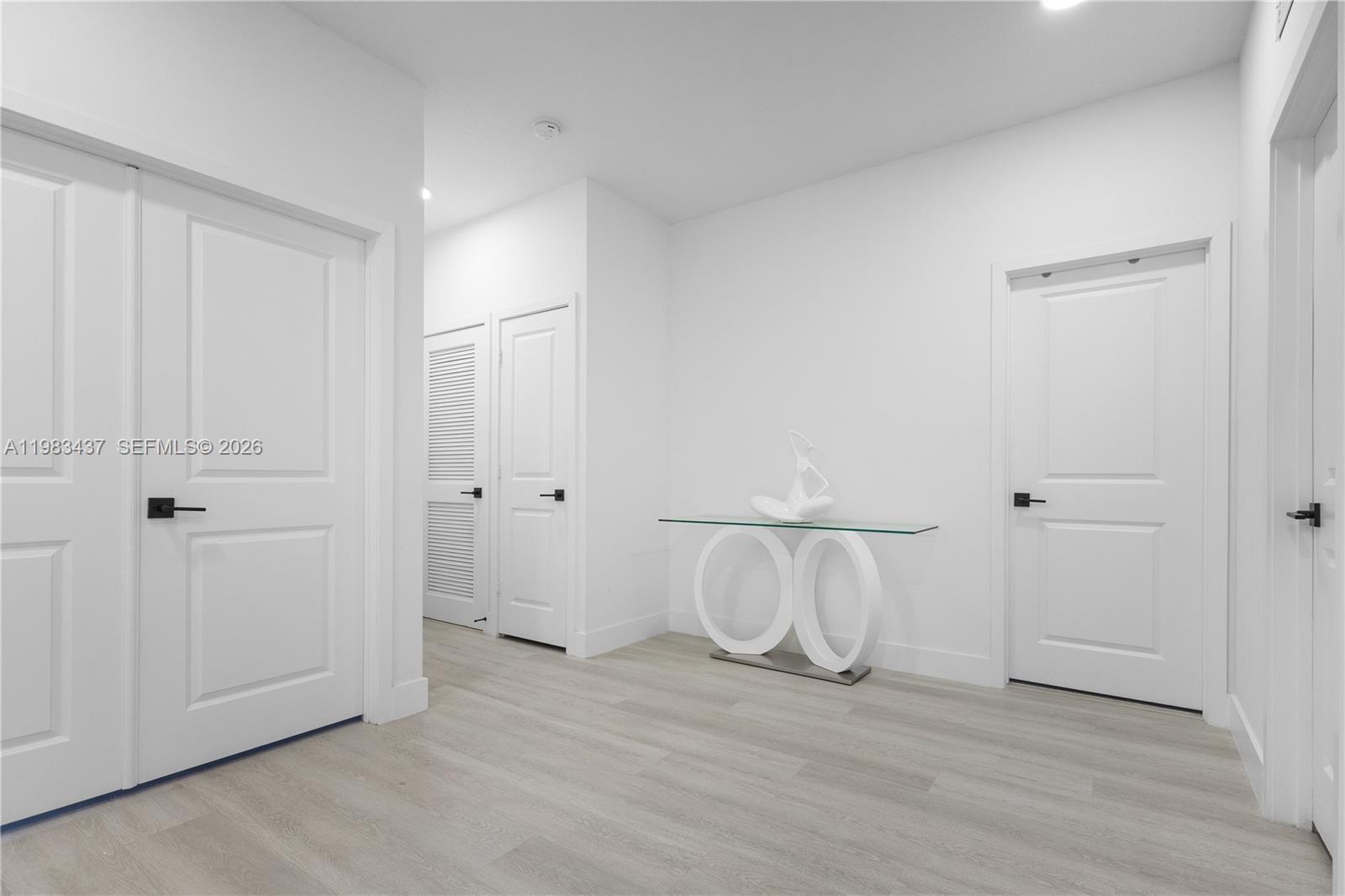 4335 Southwest 174th Avenue Miramar, FL 33029 - Photo 20 of 58 a view of a room with wooden floor and white doors