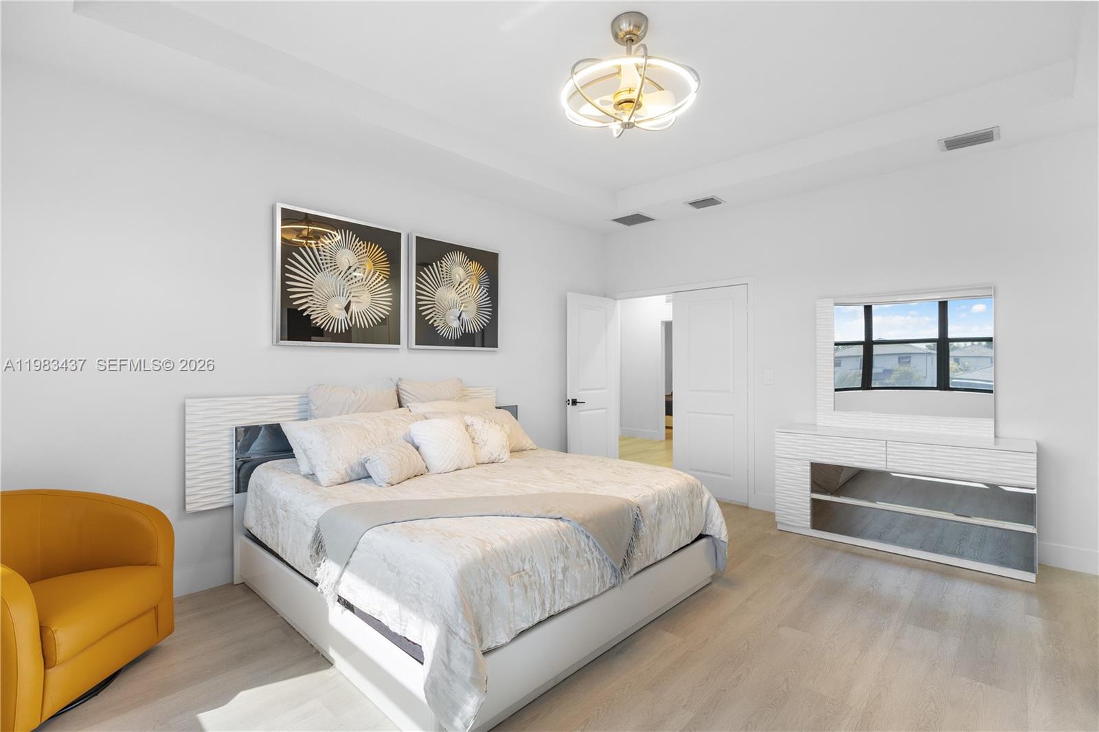 4335 Southwest 174th Avenue Miramar, FL 33029 - Photo 23 of 58 a bedroom with a bed and a chandelier
