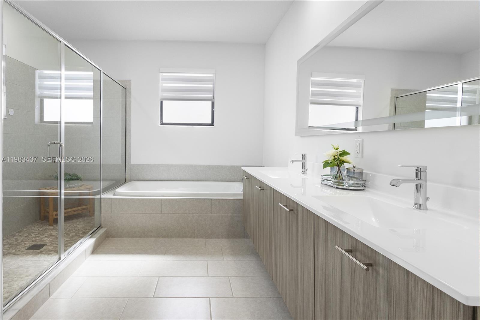 4335 Southwest 174th Avenue Miramar, FL 33029 - Photo 25 of 58 a spacious bathroom with a tub sink and mirror