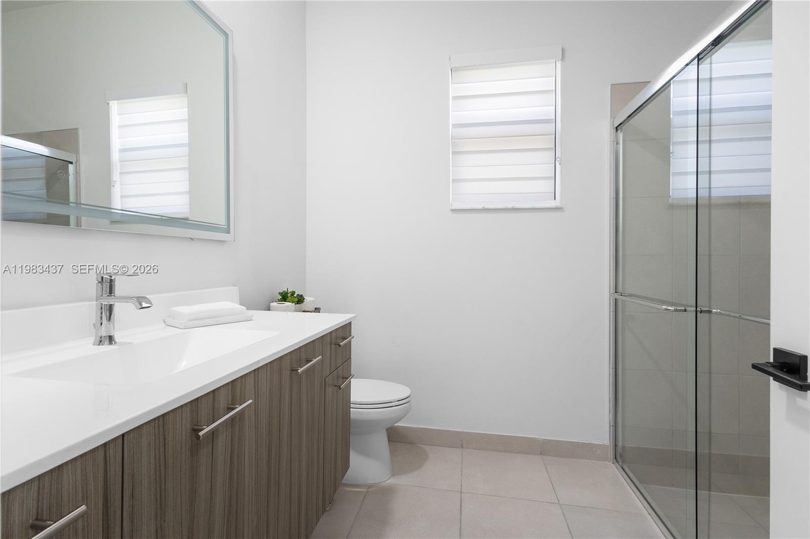 4335 Southwest 174th Avenue Miramar, FL 33029 - Photo 27 of 58 a bathroom with a sink a toilet and shower
