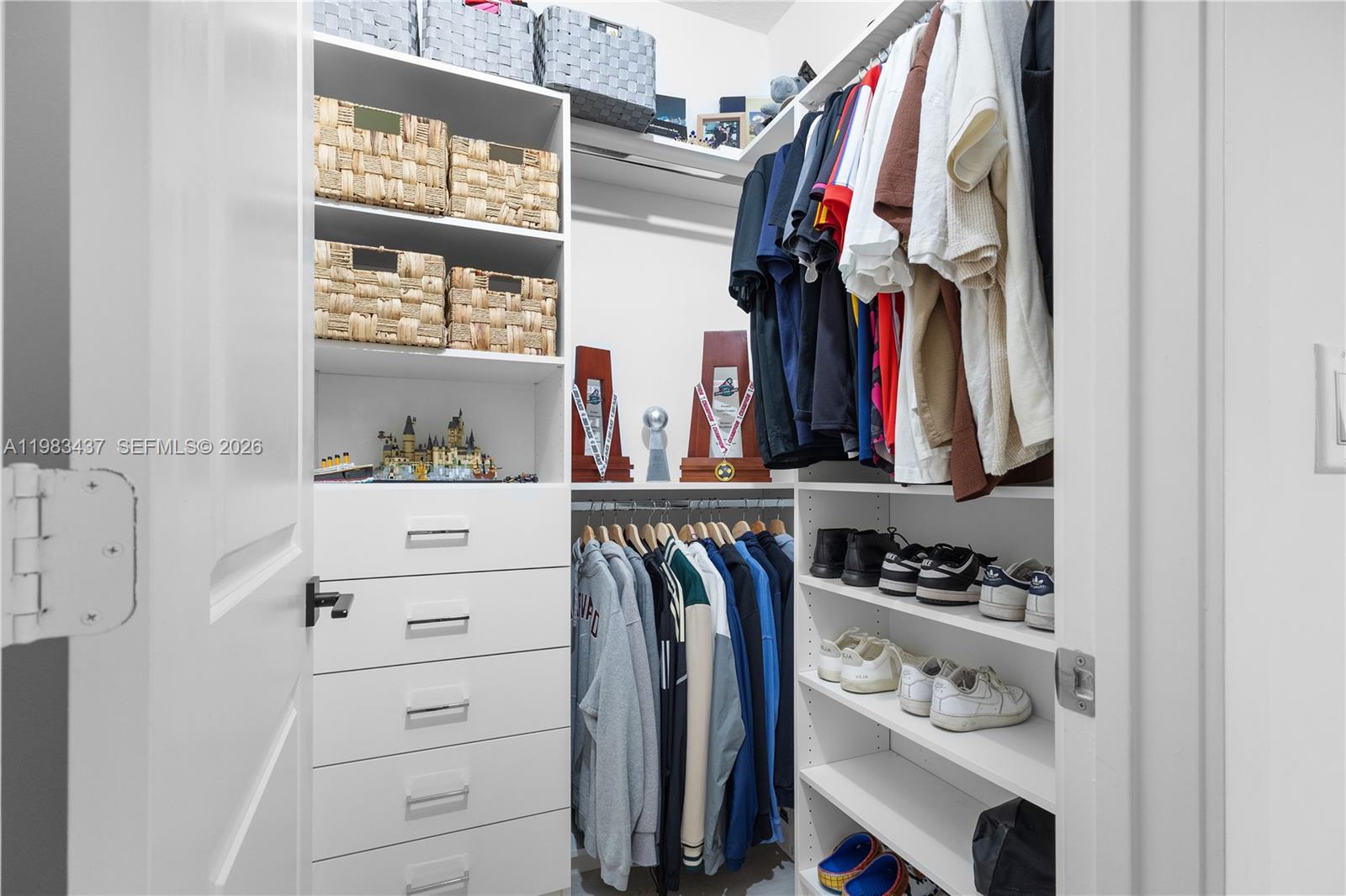 4335 Southwest 174th Avenue Miramar, FL 33029 - Photo 28 of 58 a view of walk in closet with clothes and shoes